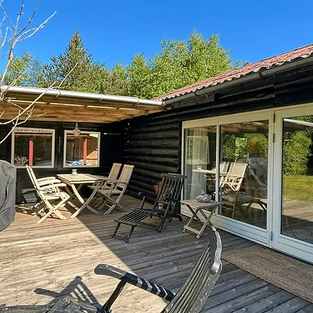 Feriehus Log On Large Nature Plot With Sun